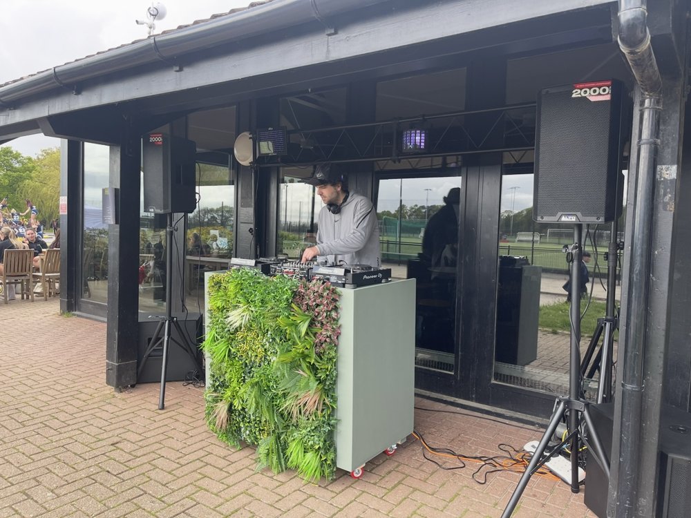 Will DJing at an outdoor venue terrace