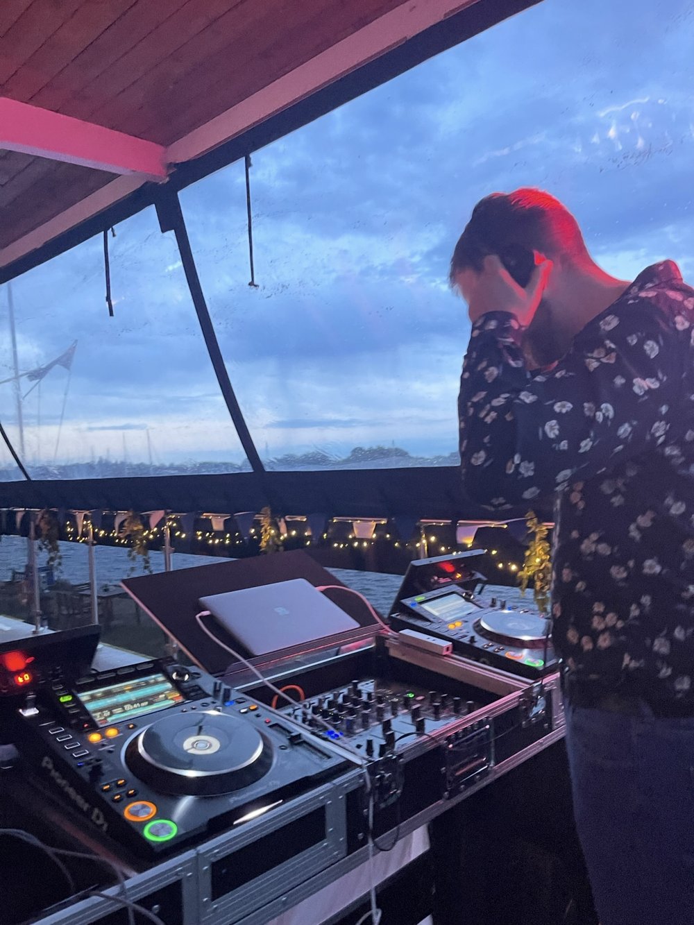 Will DJing at a waterside evening event